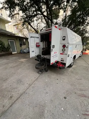 Magnet Plumbing service vehicle on-site for Grease Trap Cleaning in Titusville